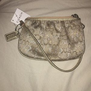 Gold coach wristlet